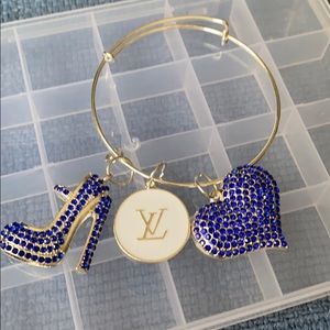 Silver plated bangle with charms